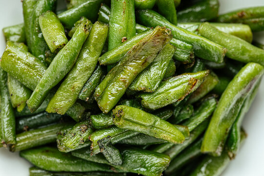 Closeup on portion of fried green string beans garnish