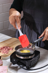 Cooking Process Pieces of Butter or Margarine Melted in a Frying Pan on a Electric Stove
