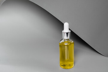 Dropper glass bottles with pipette. Transparent hyaluronic natural beauty mineral product and eco serum skin care concept. Top horizontal view copyspace. Summer juicy colors