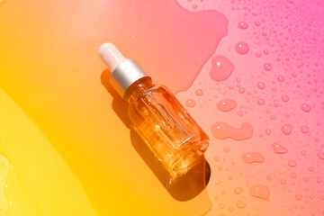 Dropper glass bottles with pipette. Transparent hyaluronic natural beauty mineral product and eco serum skin care concept. Top horizontal view copyspace. Summer juicy colors