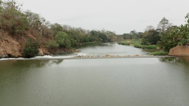 Traveling front over a river, dam on a river in Angola, Africa 6