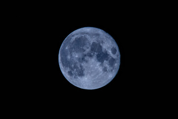 Full moon in a black sky. Astronomy concept