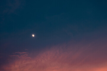 little moon on vanilla sky with clouds