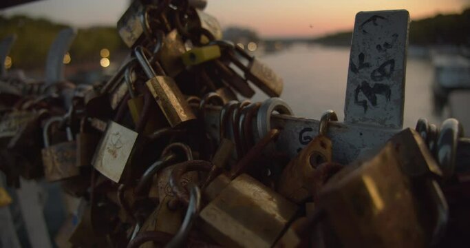 Padlocks Attached to the Bridge Railing Over the River Seine in Paris, France.
