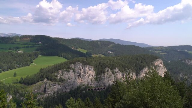 Beautiful Landscape with rock cliffs, forest and cloudy sky