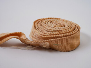 Tightly wound, very strong rope. The rope is thinner and rolled into a perfect circle. The end of...