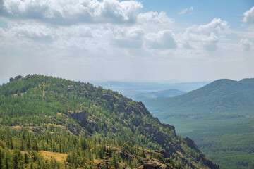 Naklejka premium beautiful landscape, mountains and hills against the sky. panorama of the forest view from the mountain