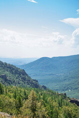 Naklejka premium beautiful landscape, mountains and hills against the sky. panorama of the forest view from the mountain