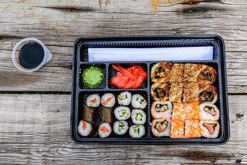 Set of the different sushi on wooden table. Top view