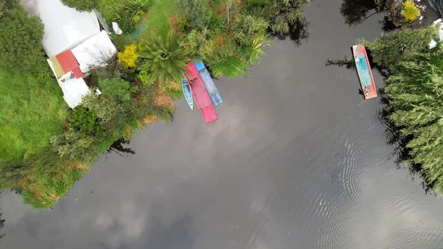 Zenith view above trajineras of Xochimilco, in Mexico City, in a cloudy day.