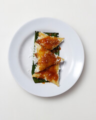 Sweet lupis cake is suitable as a snack. Lumpia is a typical Javanese food. Lupis is made from glutinous rice that is cooked and then wrapped in banana leaves. Focus blur. Lupis Mockup.
