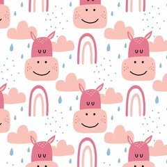 Childish hand-drawn seamless pattern with hippo and rainbow. Pattern with cute pink hippopotamus head. The pattern is suitable for prints, fabrics, cards. 