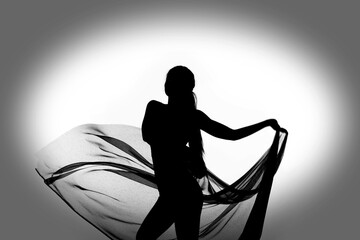 Silhouette of half body woman bodysuit dancing with transparent fabric in black and white