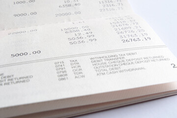 Inside page of a bank savings account passbook showing the debit and credit amount and current...