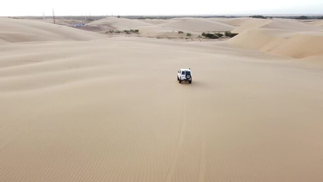 Over flight following a 4x4 truck over the desert, known as the Medanos de Coro, in Falcon State, Venezuela