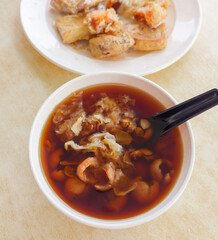 Morning breakfast snacks. Breakfast Desserts. In between meals' snacks, before or after the main dish. Sweet herbal soup, milk coofee and deep fried nian gao with yam, a popular delicacy.