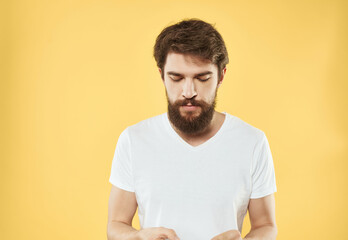 Obraz premium emotional man in a white t-shirt expressive look discontent close-up