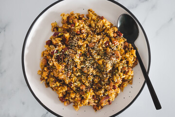 vegan potatoes beans onion and cauliflower stir fry, healthy plant-based food