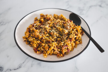 vegan potatoes beans onion and cauliflower stir fry, healthy plant-based food