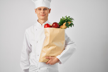 a man in a chef's uniform a package of products restaurant work service