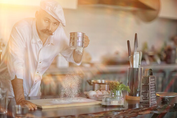 french chef in the kitchen preparing food, cooking, haute cuisine, man with mustache