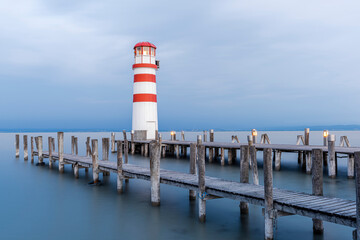 Wooden Pier with Lighthouse in Podersdorf on Lake Neusiedler in Austria at Sunrise.