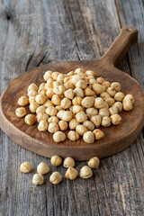 Roasted hazelnut. Hazelnuts on wood background. Bulk Hazelnut kernels