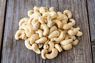 Cashew nuts. Cashew on wood background. Bulk Cashews