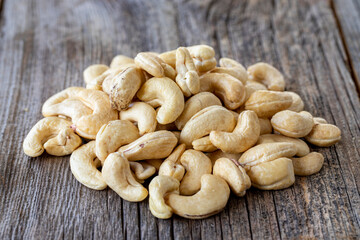 Cashew nuts. Cashew on wood background. Bulk Cashews