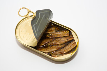 sprats in a tin can on a white background