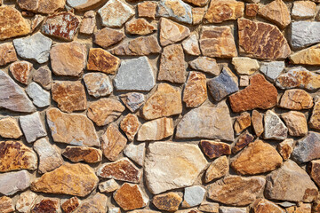 Background stone wall lined with natural stone,