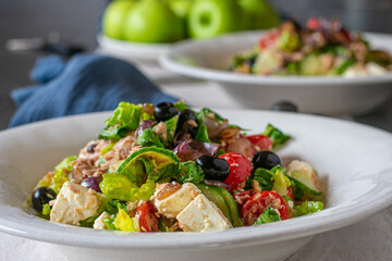 Greek salad with feta cheese, tuna and vegetables