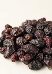 Dried rose hips. Close-up. Macro. Light background.
