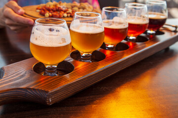 beer set, Set of glasses of light and dark beer on a pub background.