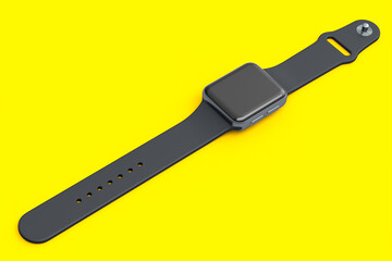 Stainless silver smart watch or fitness tracker isolated on yellow background.