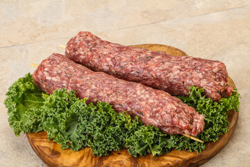 Raw minced beef kebab skewer