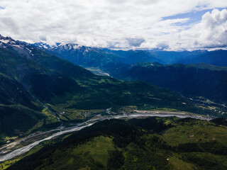 Fototapeta na wymiar Georgia mountains blue sky aerial drone photo waterfalls and lakes green hills