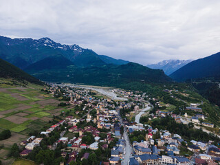Fototapeta na wymiar Svaneti Mestia Georgia mountains history towers beautiful old town and nature aerial drone photo
