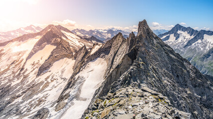 Pointed rocky mountain ridge on sunny summer day. Schwarzkopf peak in Zillertaler Alps, Austria