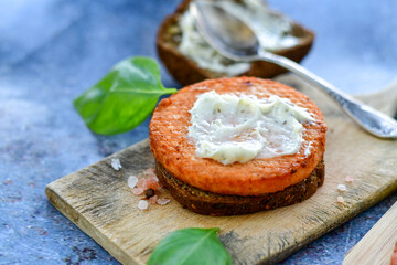 Homemade ketogenic  Salmon Burger with Tartar Sauce and  whole grain ketgenic bread. Healty food