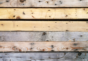 Naklejka premium beautiful texture of old scenic assorted wooden boards fastened together