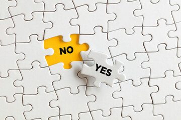 Obraz premium The words no and yes on the missing puzzle pieces. To learn to say no