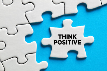 Fototapeta premium Think positive message on a puzzle piece