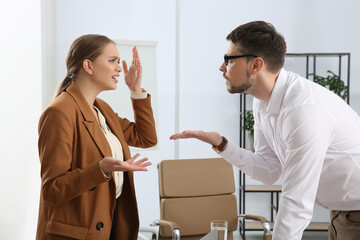 Emotional colleagues arguing in office. Toxic work environment