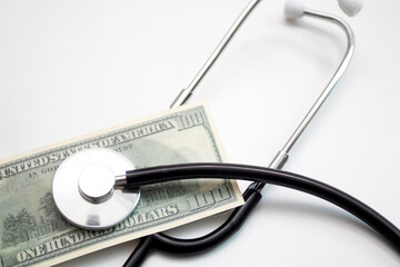 Medical stethoscope and USA dollars