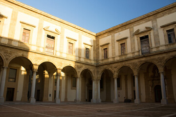Obraz premium Mazara del Vallo, Sicily, Italy, January 19, 2020 evocative image of the main courtyard of the baroque palace of the Jesuit College