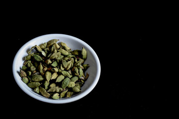A Close up picture of Cardamom seeds which is an important spice ingredient for preparing sweet dishes in Indian food.