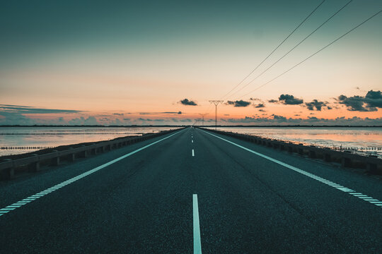 Street on the dam to the island of Romo in the Danish part of the Wadden Sea National Park which is Unesco heritage