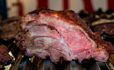 large cut of beef roasted on the barbecue grill