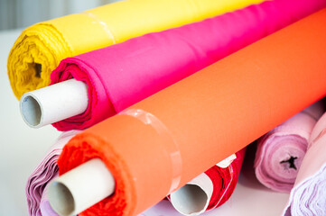 Interior of garment factory . Closes making atelier with several sewing machines. Tailoring industry, fashion designer workshop, industry concept